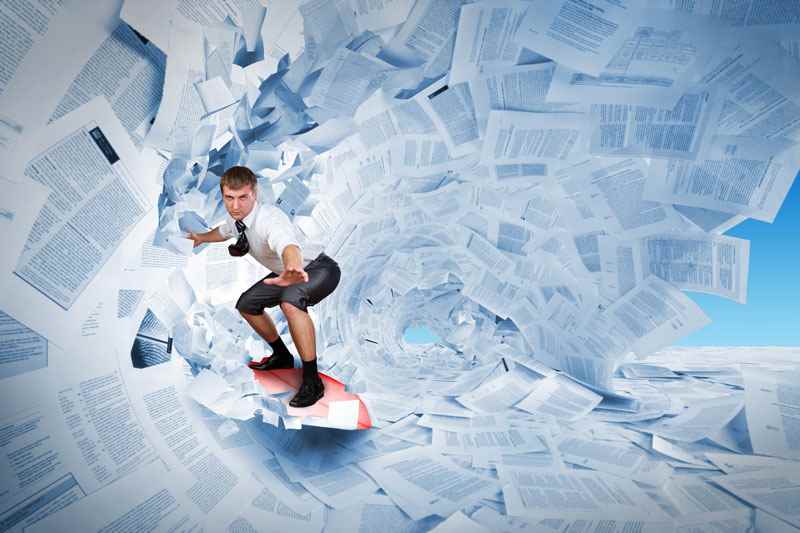 How long should a CV be? Man riding waves of paper