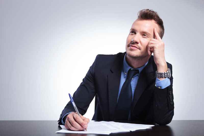 How long should a CV be? Man writing CV